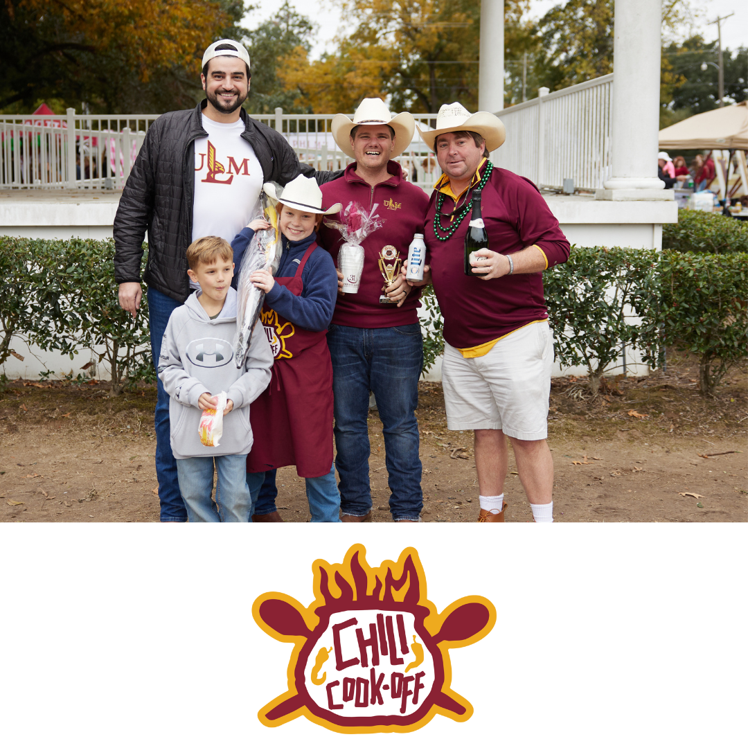 “Group of ULM alumni and children posing together at the Alumni Association CHILI Cook-Off event.