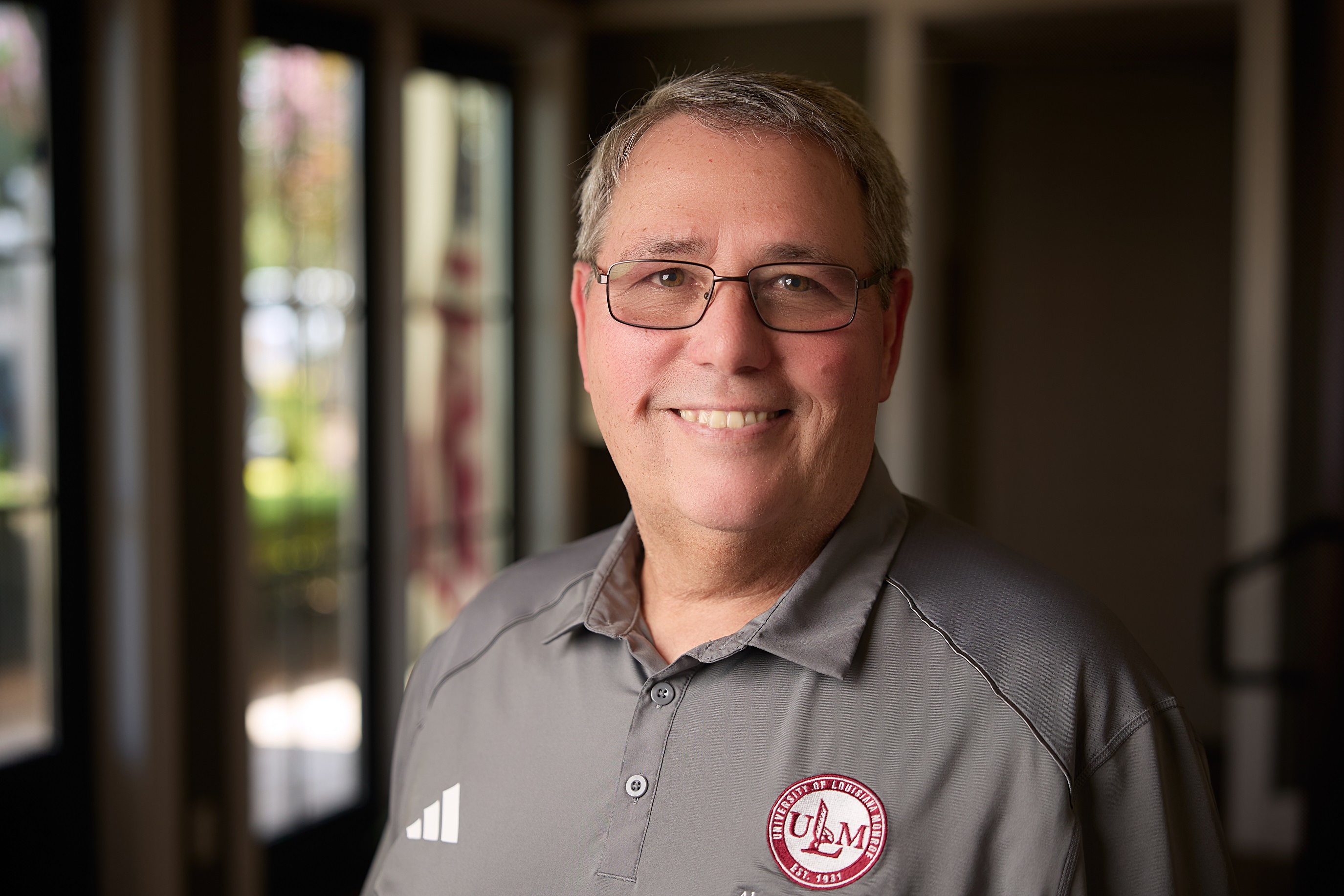 Photo of David Smith Portrait of David Smith ULM Alumni Association Board Member, standing on campus near the bayou.