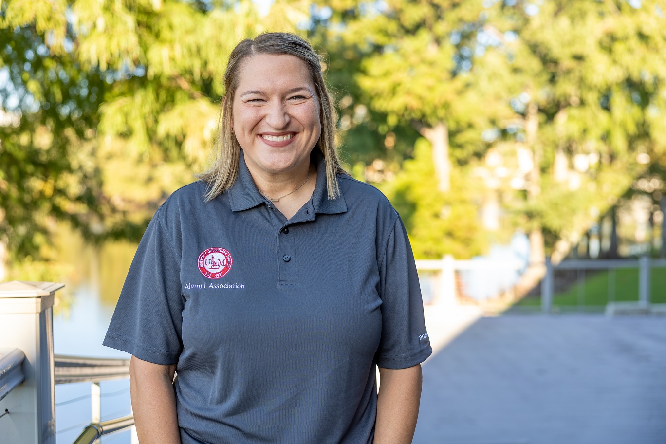 Portrait of Maggie Generoso, ULM Alumni Association Board President, standing on campus near the bayou. Portrait of Maggie Generoso, ULM Alumni Association Board President, standing on campus near the bayou.
