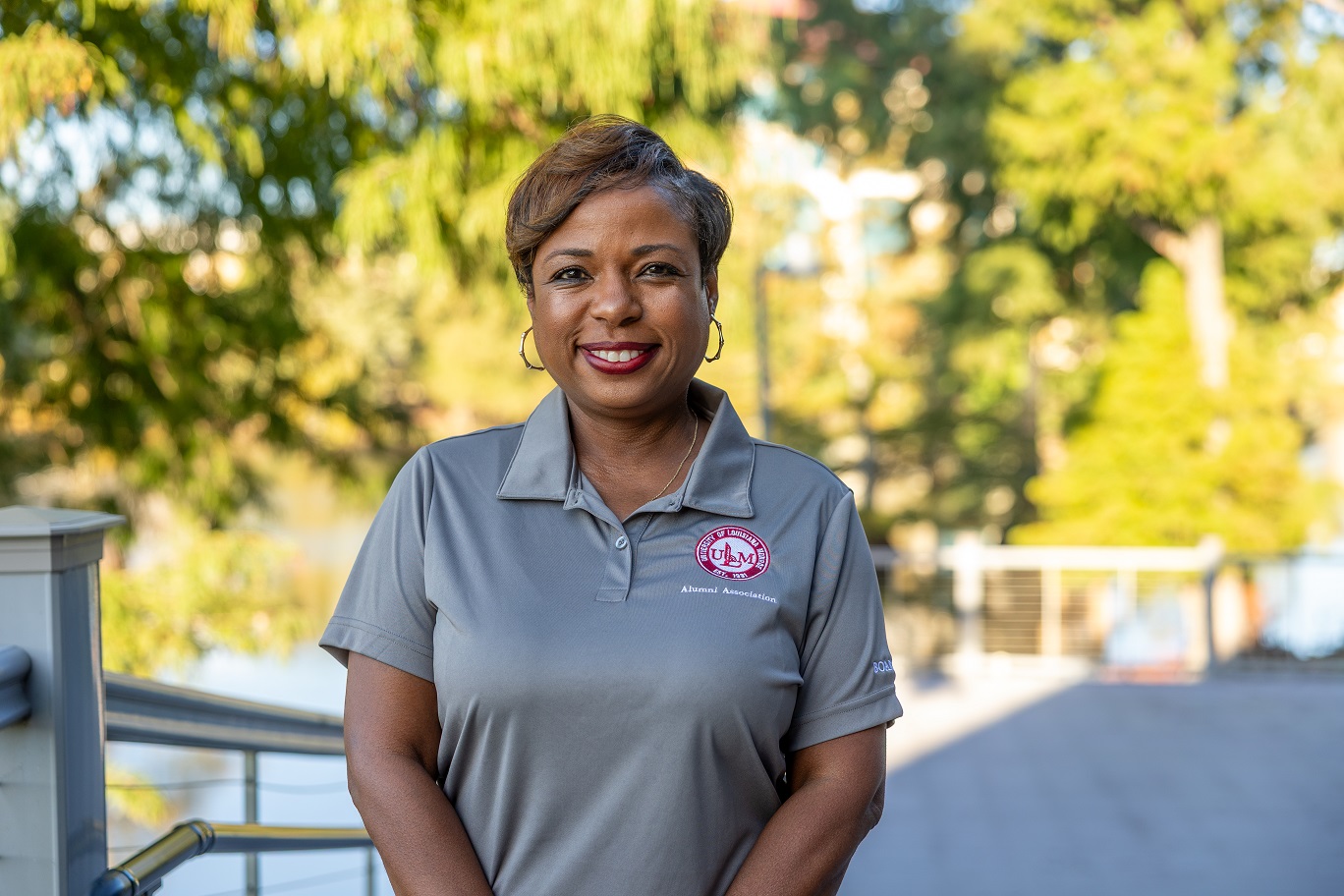 Photo of Twainna Calhoun Portrait of Twainna Calhoun, ULM Alumni Association Board Member, standing on campus near the bayou.