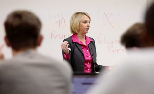  Professor speaking to students in classroom
