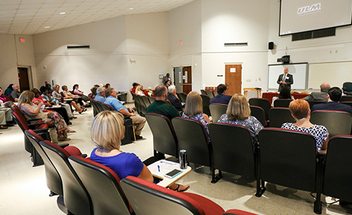  students in classroom with instructor at the front