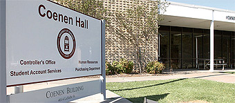 Coenen Hall sign and building where some campus offices are located