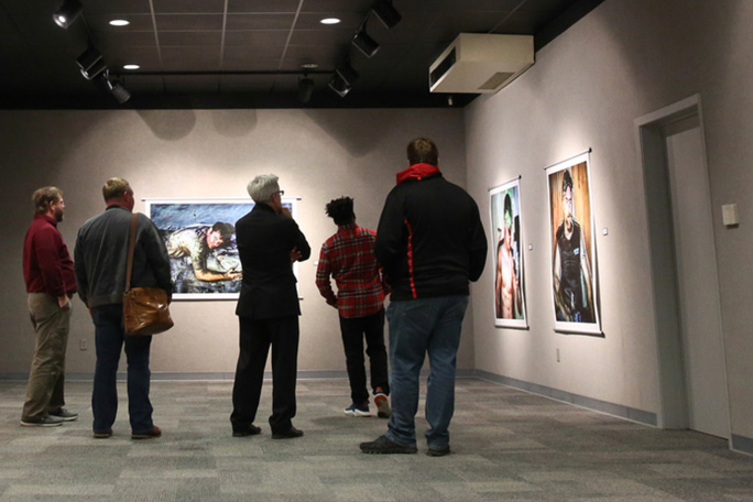 people viewing art on the walls of Bry Gallery