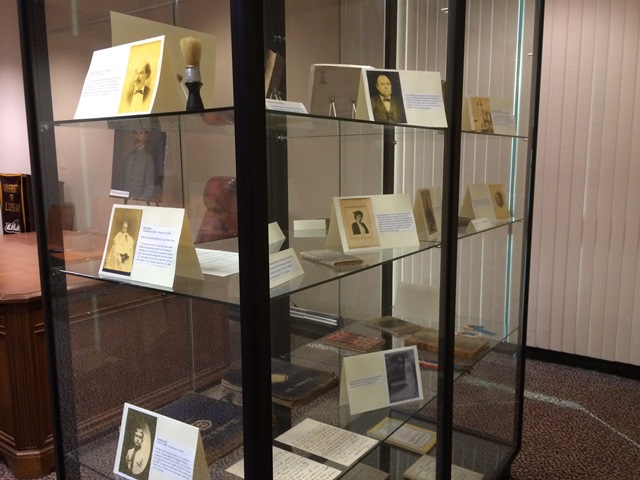 The image shows a display case featuring the Andrew Augustus Gunby Legacy Collection. Specifically, the case includes family artifacts, photographs, personal manuscripts like poems and letters, and other unique items to Gunby’s life and legacy. Andrew Augustus Gunby, was a lawyer, educator, author, and Louisiana appeals court judge from Monroe, Louisiana.