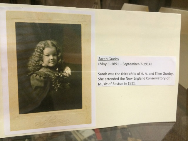 The displayed photograph features a child, identified as Sarah Gunby. Sarah lived from May 1, 1891 to September 7, 1914. She was the third child of A. A. and Ellen Gunby.