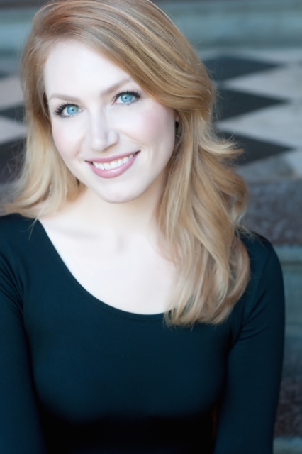 Nancy Carey, Assistant Professor of Music, is wearing a black dress.