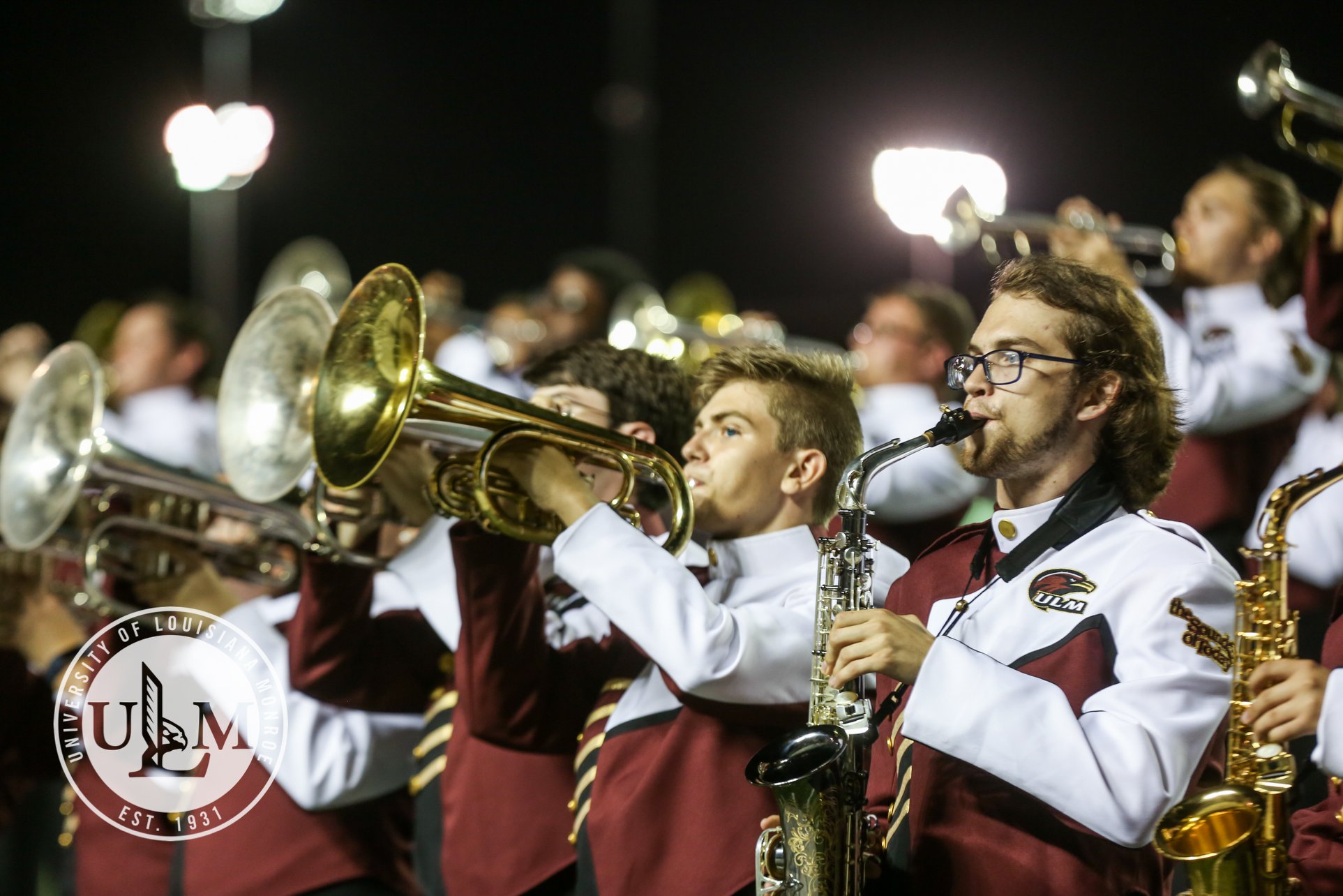 Members of the Sound of Today Marching Band performing in the stands at Malone Stadium.