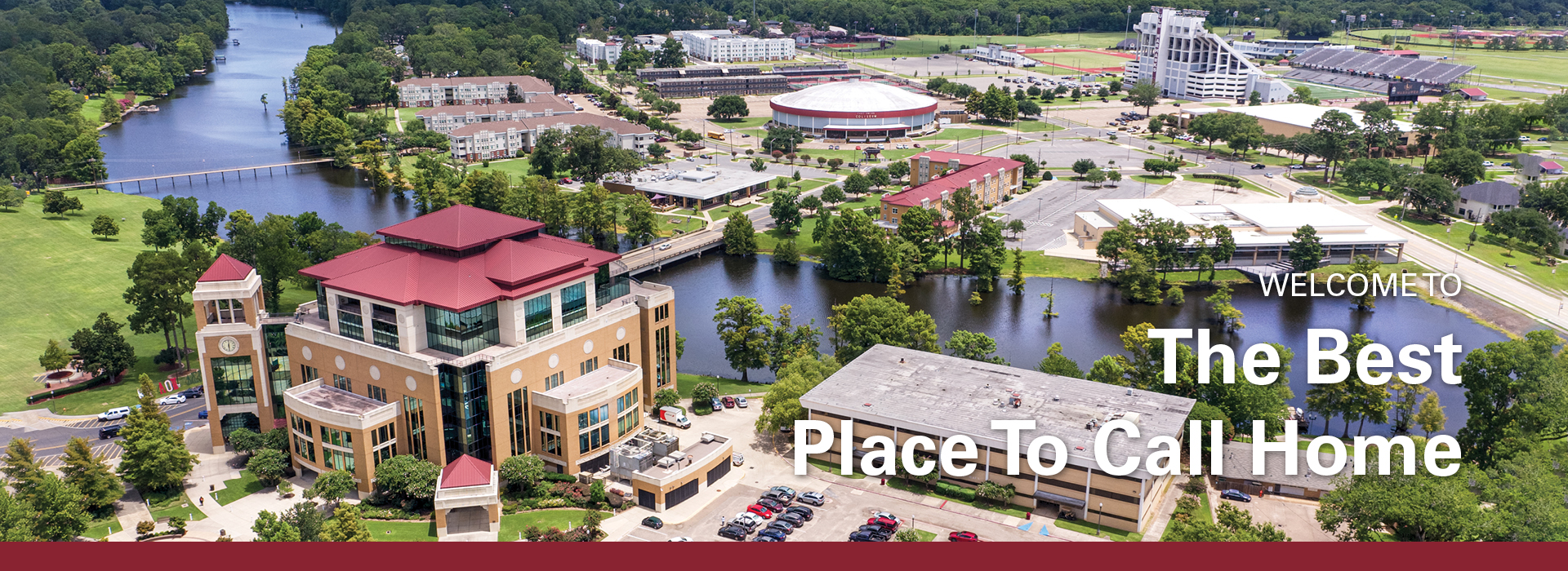 University of Louisiana Monroe campus areal view of the Library and the bayou with overlay text: "WELCOME TO The Best Place To Call Home"