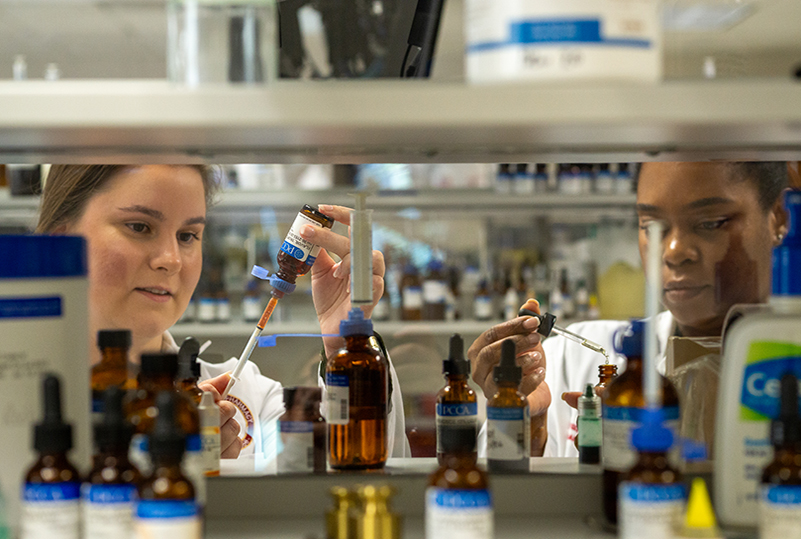Two College of Pharmacy students in the Pharmacy Care Lab.