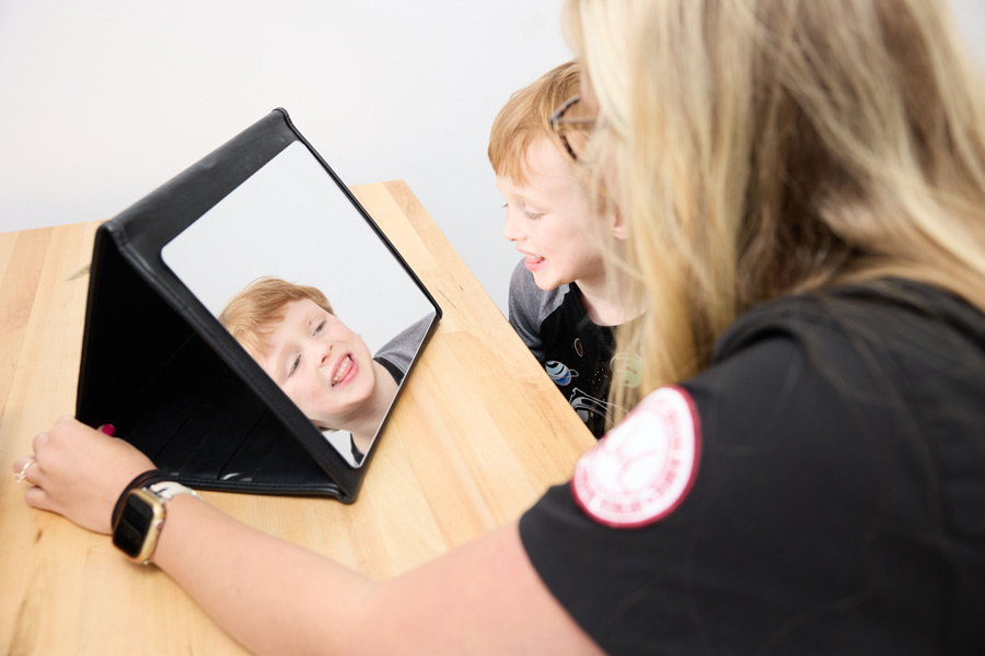 child client receiving articulation therapy